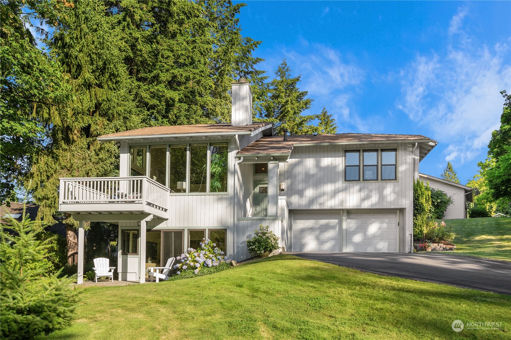 5922 158th Way Northeast Redmond, WA 98052 - Photo 1 of 31 a front view of a house with a garden