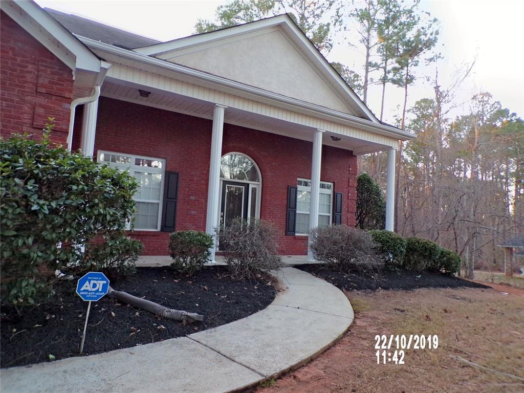 1035 Upchurch Road McDonough, GA 30252 - Photo 40 of 48 a front view of a house with garden