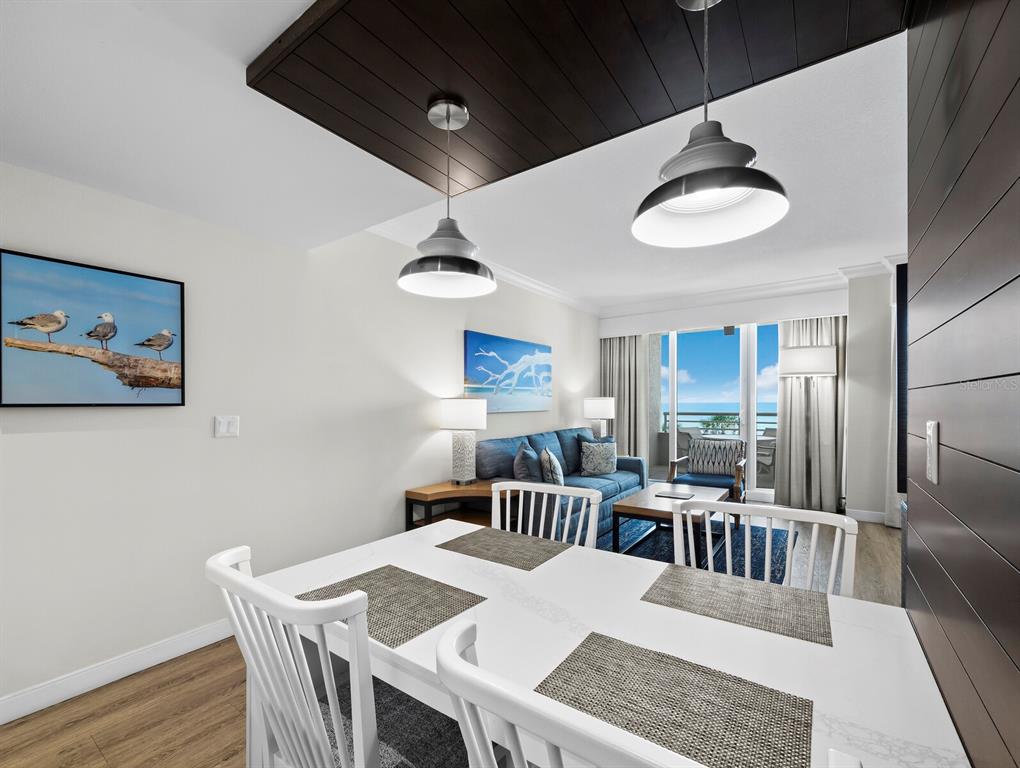 210 Sands Point Road, Unit 2405 Longboat Key, FL 34228 - Photo 12 of 36 a view of a dining room with furniture