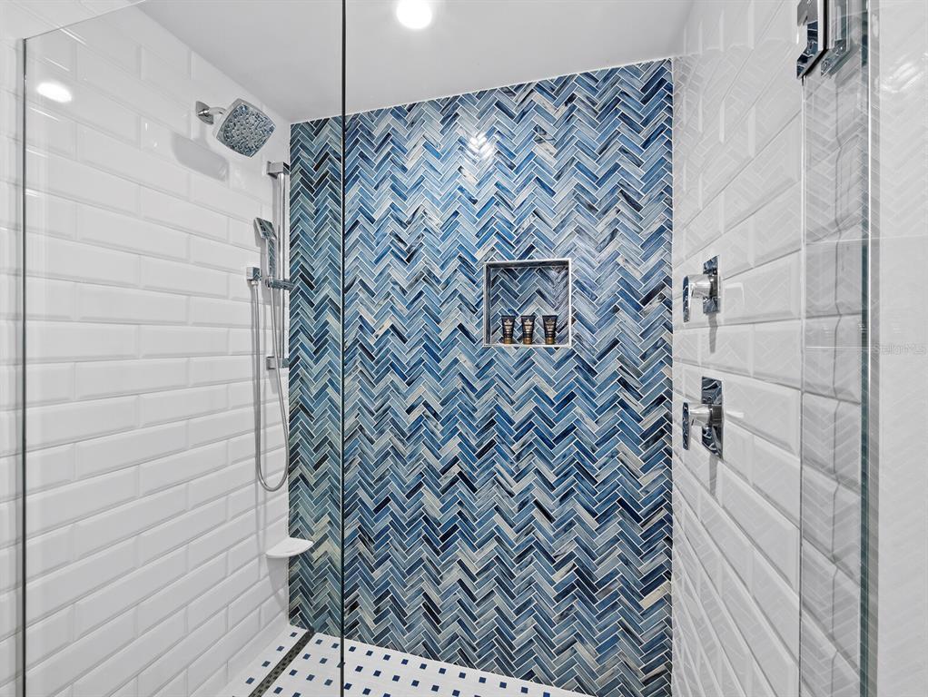 210 Sands Point Road, Unit 2405 Longboat Key, FL 34228 - Photo 19 of 36 a bathroom with a shower