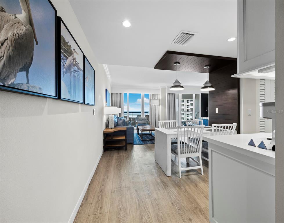 210 Sands Point Road, Unit 2405 Longboat Key, FL 34228 - Photo 5 of 36 a living room with furniture and a flat screen tv