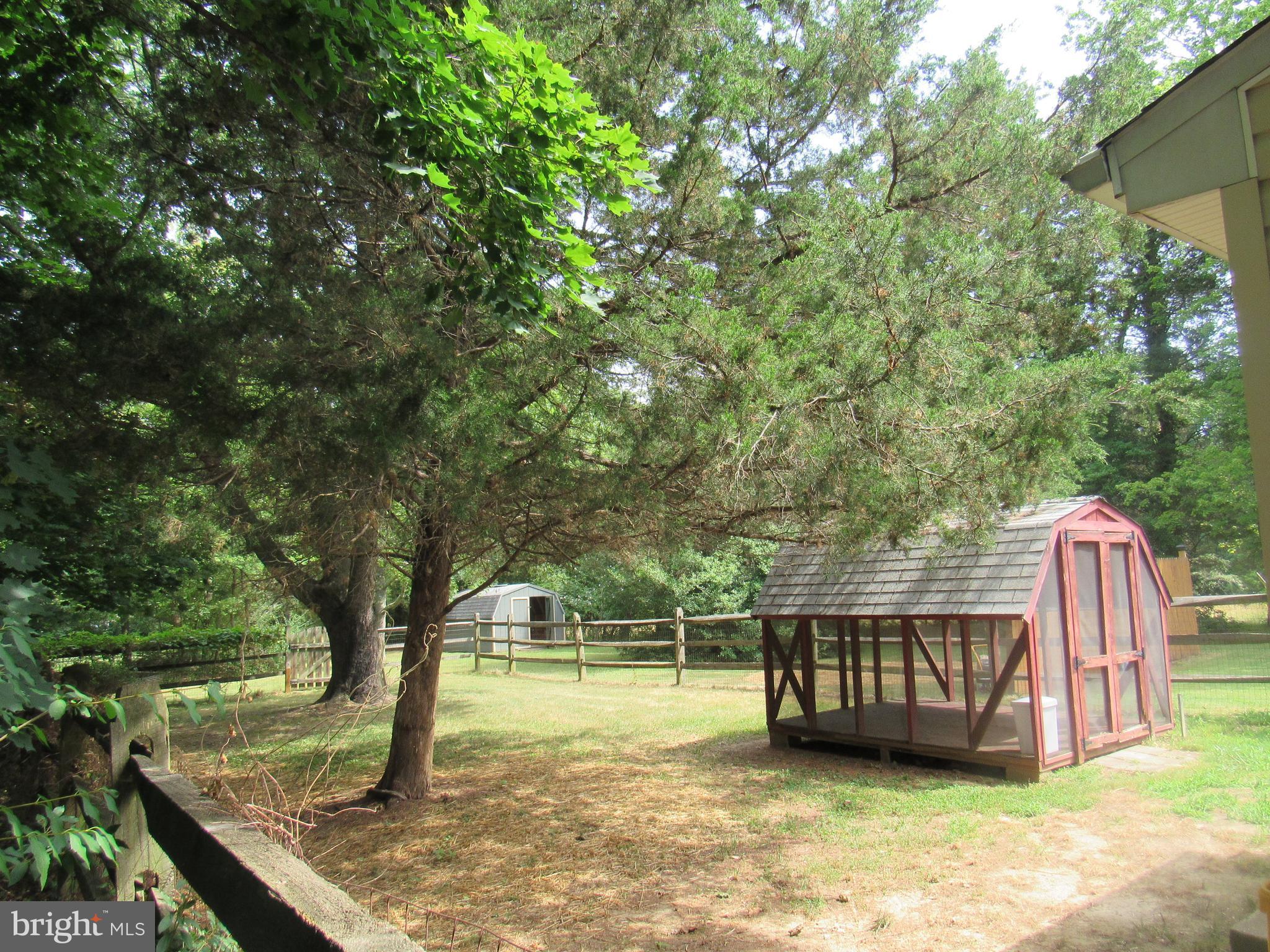 15619 Livingston Road Accokeek, MD 20607 - Photo 11 of 18 a view of a yard with wooden fence and a bench