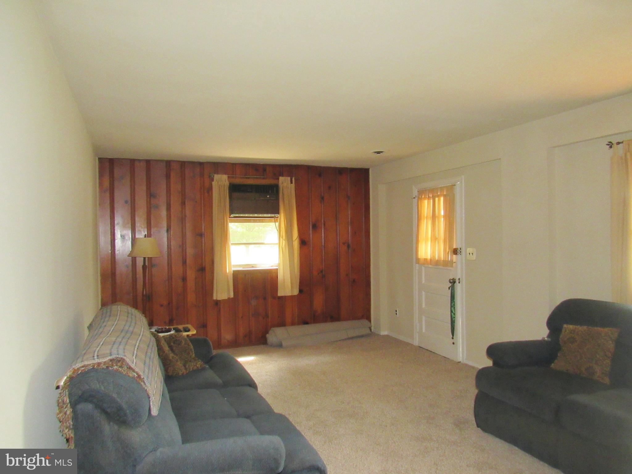 15619 Livingston Road Accokeek, MD 20607 - Photo 3 of 18 a living room with furniture and a window