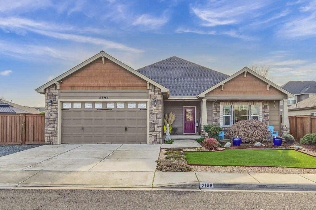 2198 Rabun Way Central Point, OR 97502 - Photo 1 of 47 a front view of a house with a yard and garage