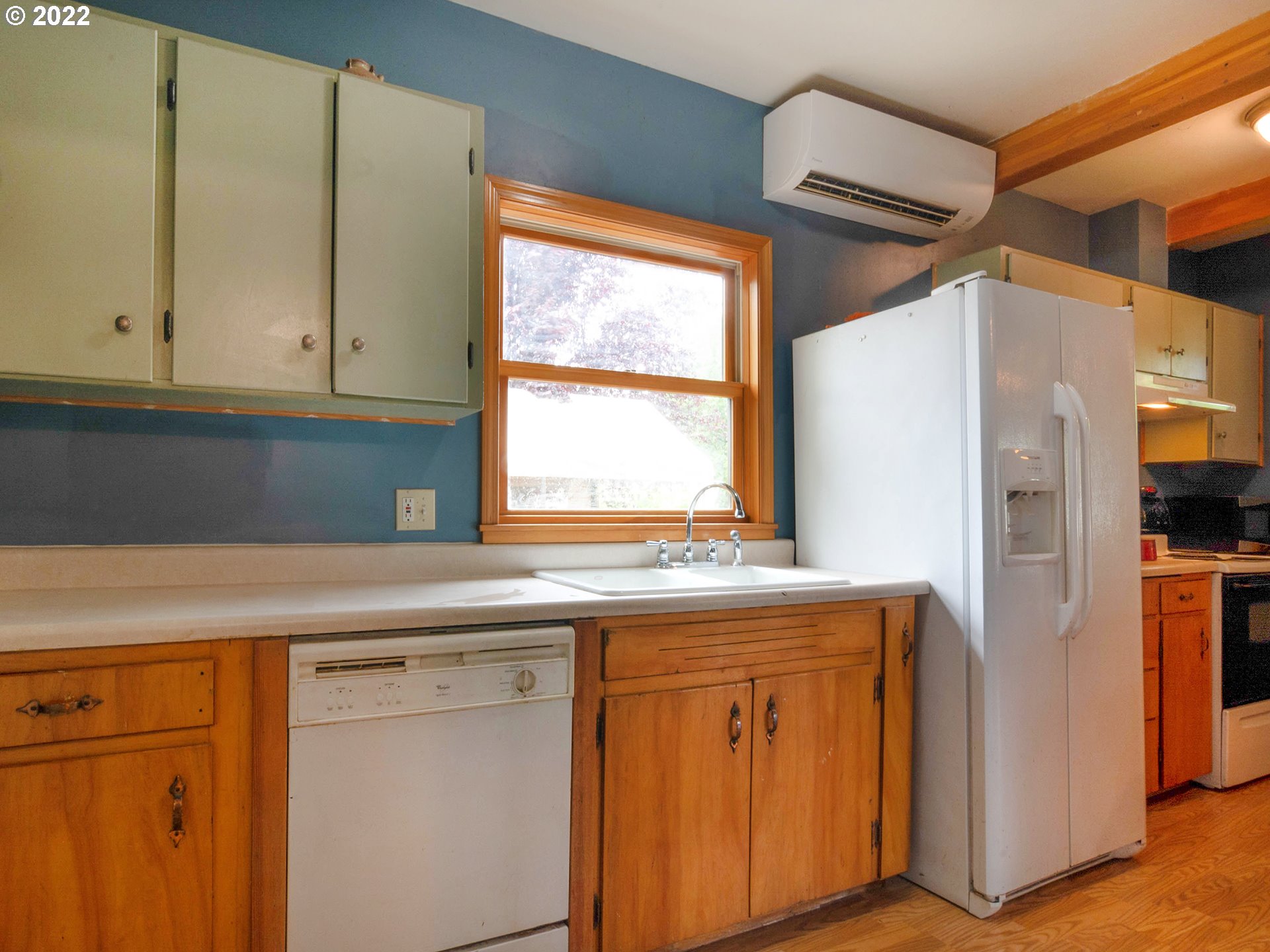 1239 D Street Springfield, OR 97477 - Photo 11 of 32 a kitchen with stainless steel appliances granite countertop a refrigerator and a sink