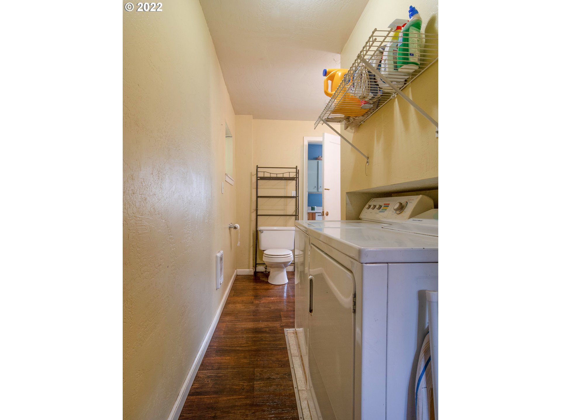 1239 D Street Springfield, OR 97477 - Photo 13 of 32 a hallway with cabinets