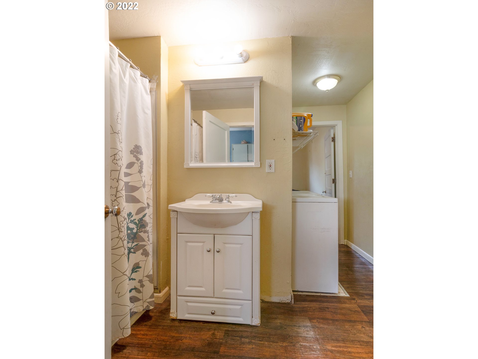 1239 D Street Springfield, OR 97477 - Photo 14 of 32 a bathroom with a sink and a mirror