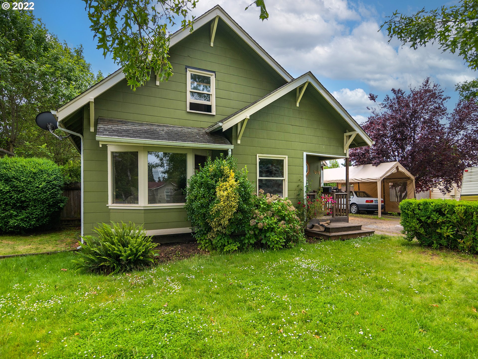 1239 D Street Springfield, OR 97477 - Photo 2 of 32 a front view of house with yard and green space