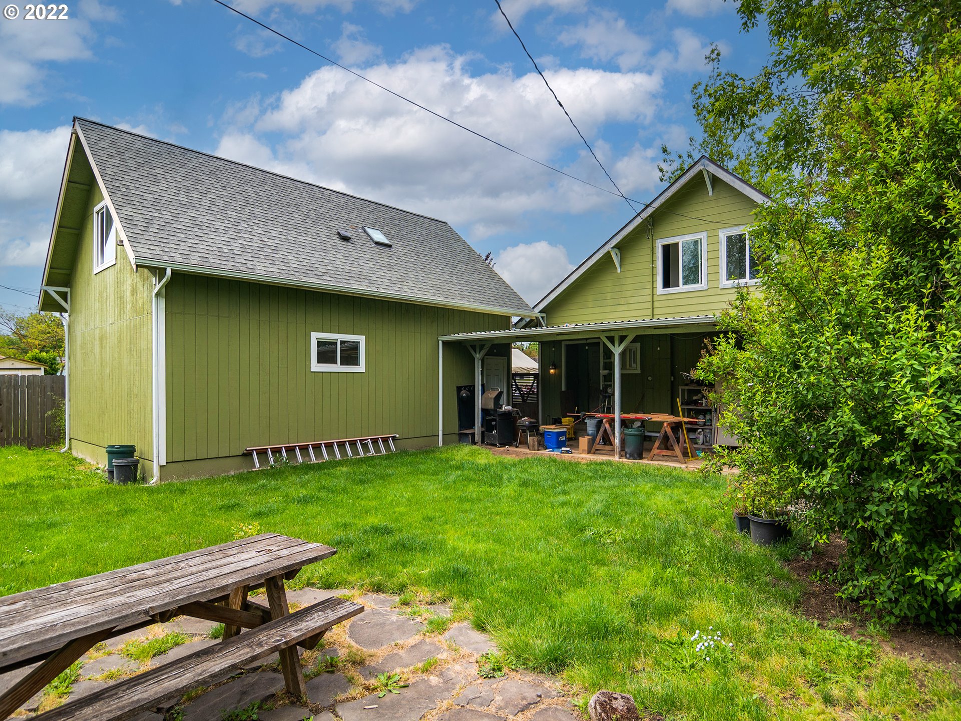 1239 D Street Springfield, OR 97477 - Photo 30 of 32 a view of a house with backyard and sitting area