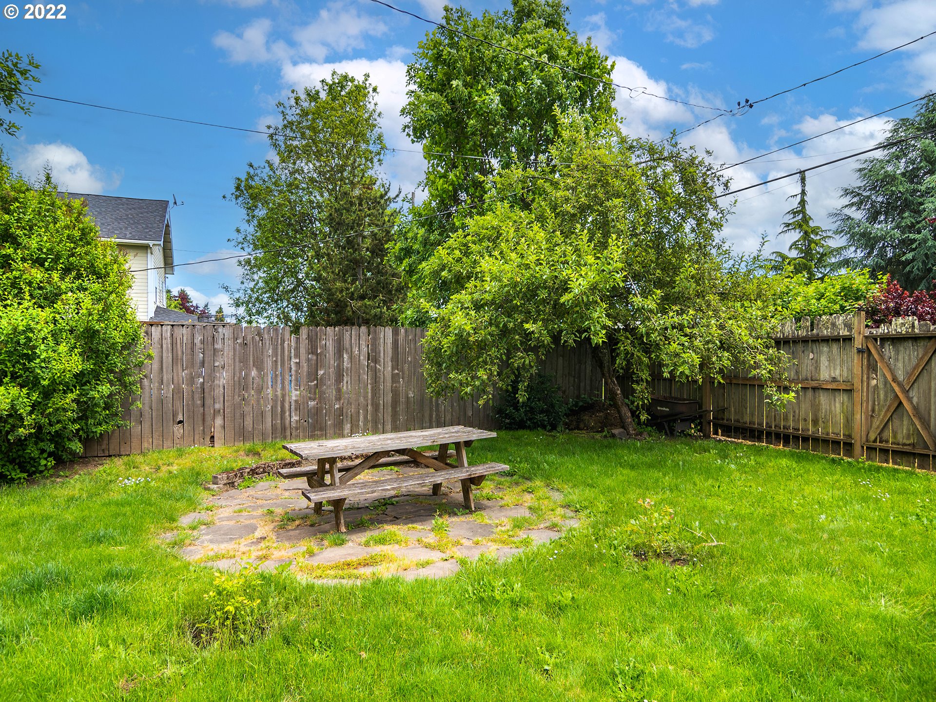 1239 D Street Springfield, OR 97477 - Photo 31 of 32 a backyard of a house with table and chairs