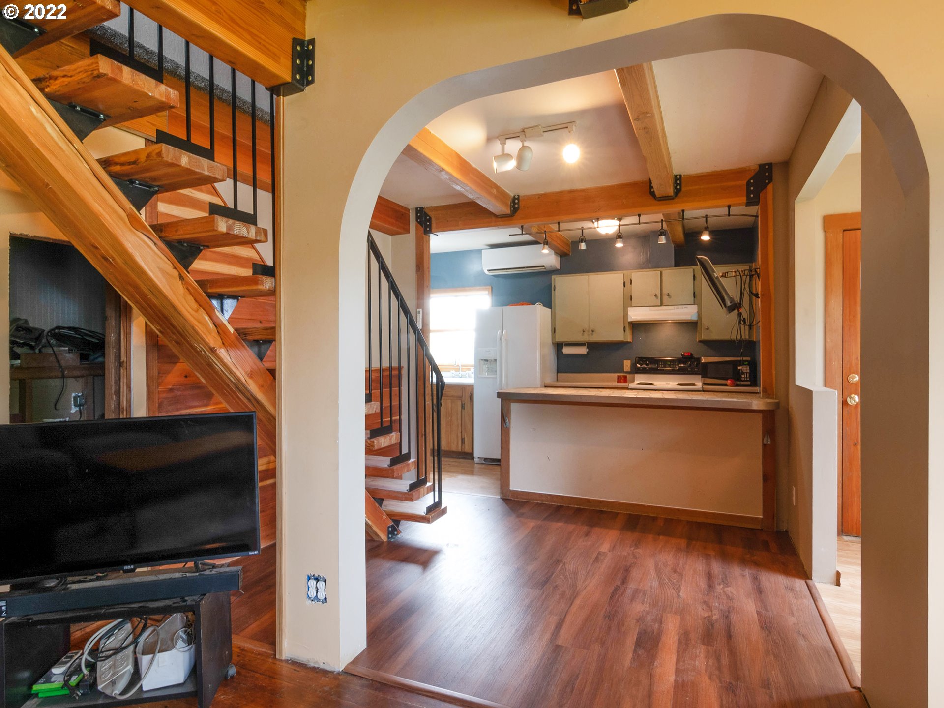 1239 D Street Springfield, OR 97477 - Photo 5 of 32 a view of hallway with wooden floor and stairs