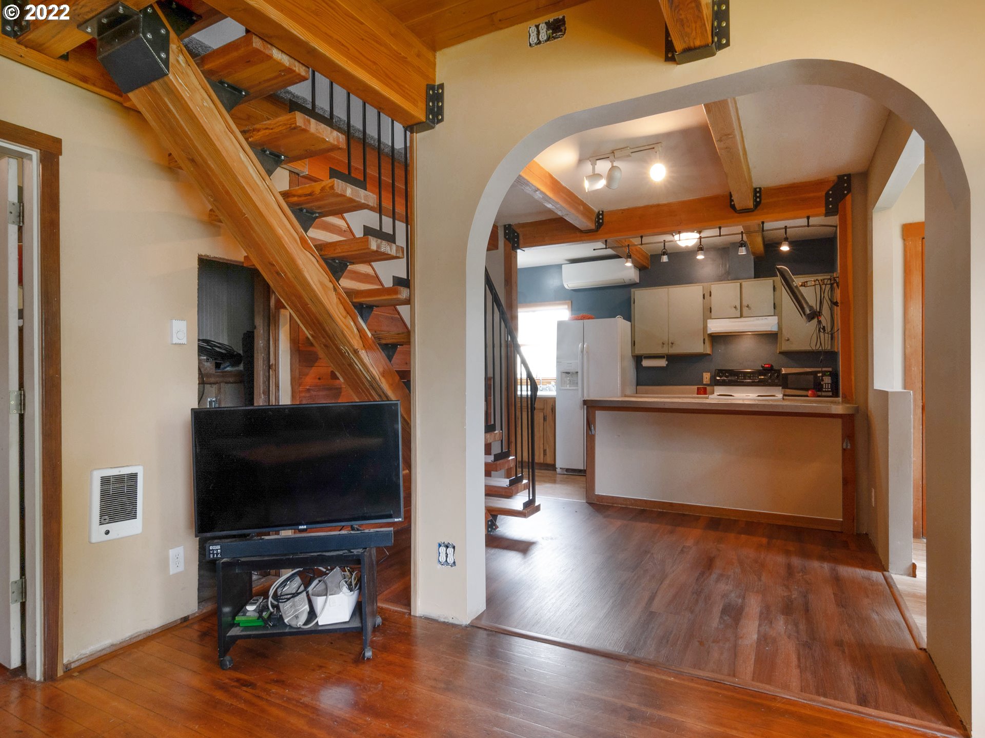 1239 D Street Springfield, OR 97477 - Photo 7 of 32 a view of living room kitchen and a wooden floor