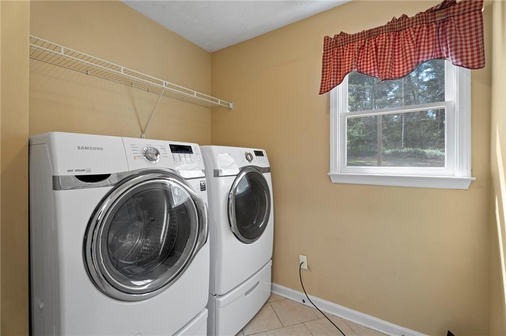 1381 Gateswalk Path Lawrenceville, GA 30045 - Photo 14 of 45 a utility room with dryer and washer