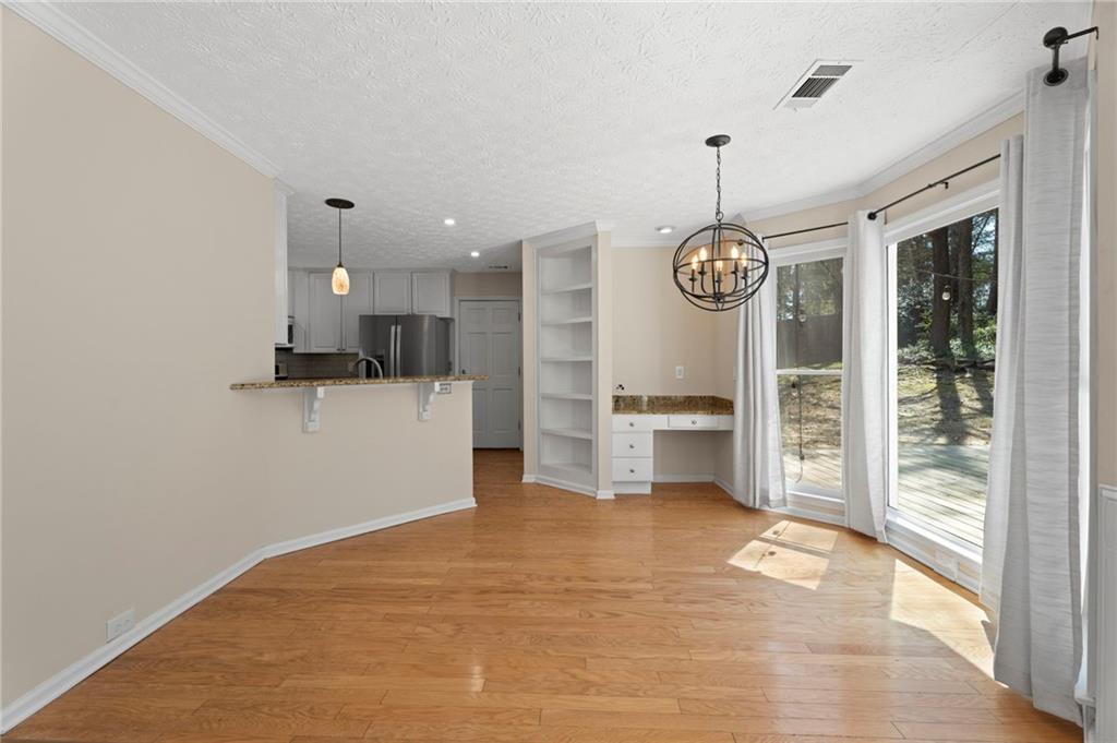 1381 Gateswalk Path Lawrenceville, GA 30045 - Photo 15 of 45 a view of an empty room with a kitchen