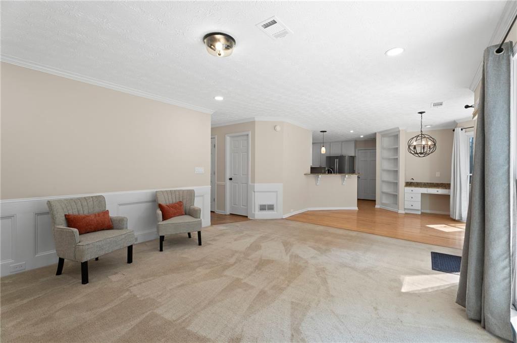 1381 Gateswalk Path Lawrenceville, GA 30045 - Photo 20 of 45 a spacious bedroom with a bed and a table