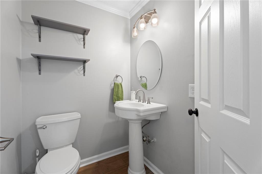 1381 Gateswalk Path Lawrenceville, GA 30045 - Photo 21 of 45 a bathroom with a toilet sink and mirror