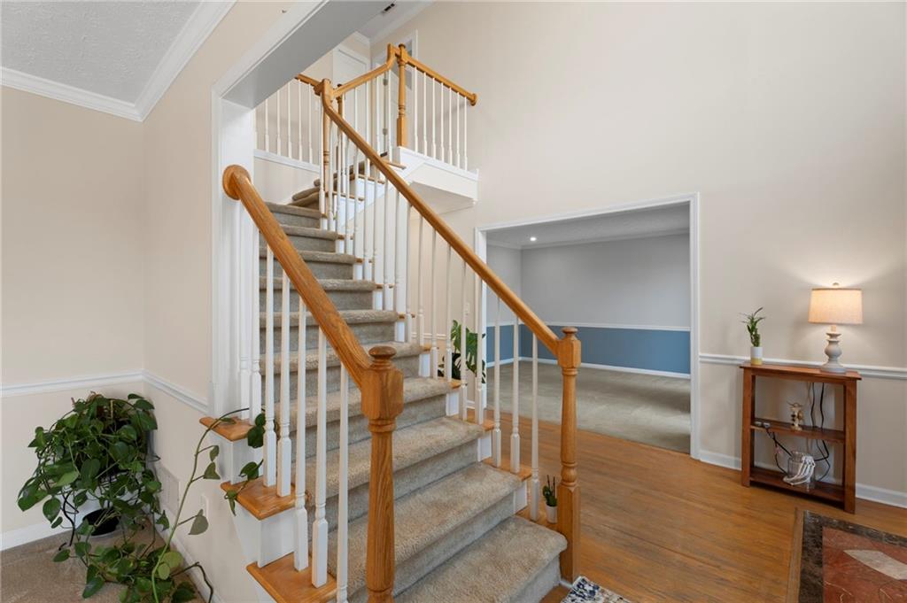 1381 Gateswalk Path Lawrenceville, GA 30045 - Photo 22 of 45 a view of entryway and hall with wooden floor
