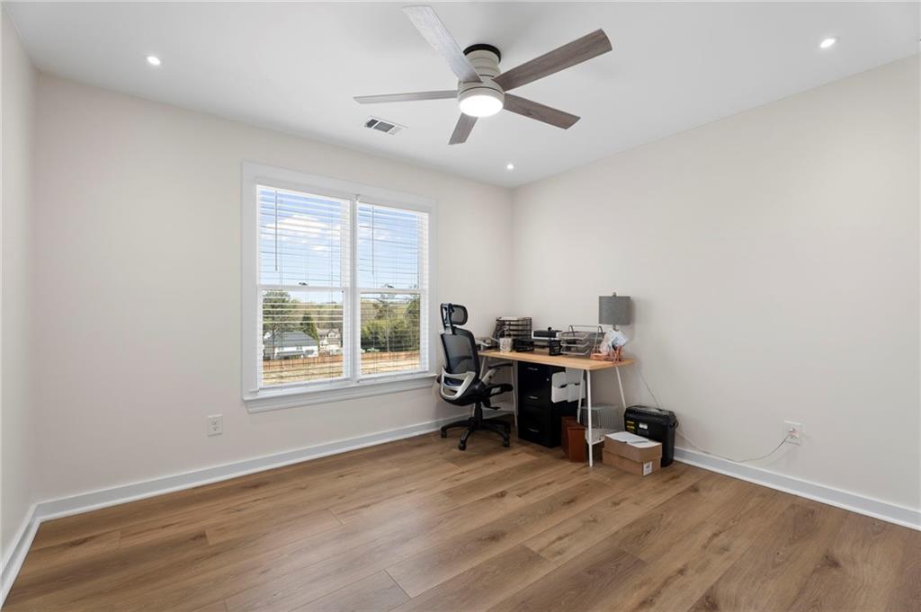 1381 Gateswalk Path Lawrenceville, GA 30045 - Photo 24 of 45 a view of a workspace with furniture and a window