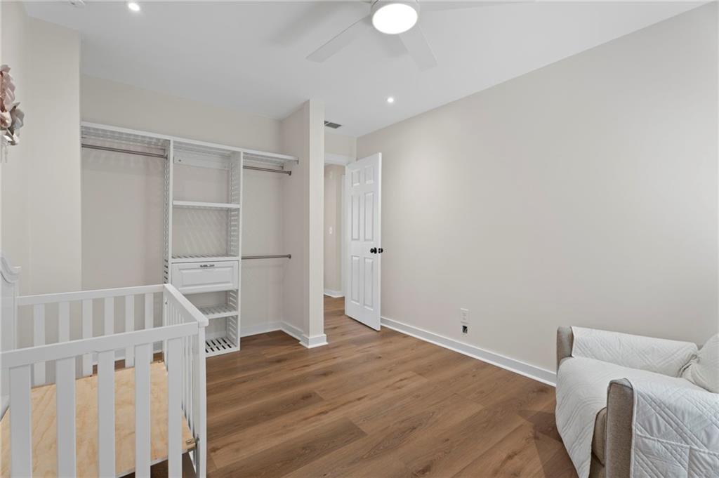 1381 Gateswalk Path Lawrenceville, GA 30045 - Photo 27 of 45 a view of a room with wooden floor and white walls