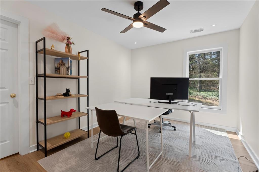 1381 Gateswalk Path Lawrenceville, GA 30045 - Photo 28 of 45 a view of a workspace with furniture and a window