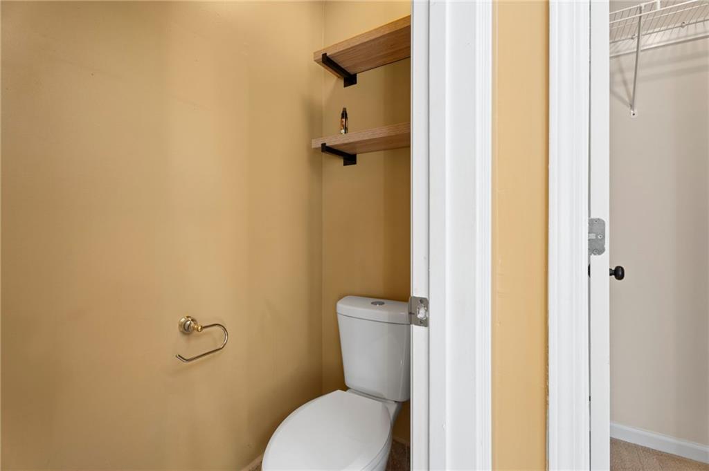 1381 Gateswalk Path Lawrenceville, GA 30045 - Photo 37 of 45 a bathroom with a granite countertop toilet