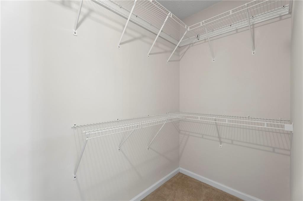 1381 Gateswalk Path Lawrenceville, GA 30045 - Photo 38 of 45 a view of a room with racks on the wall