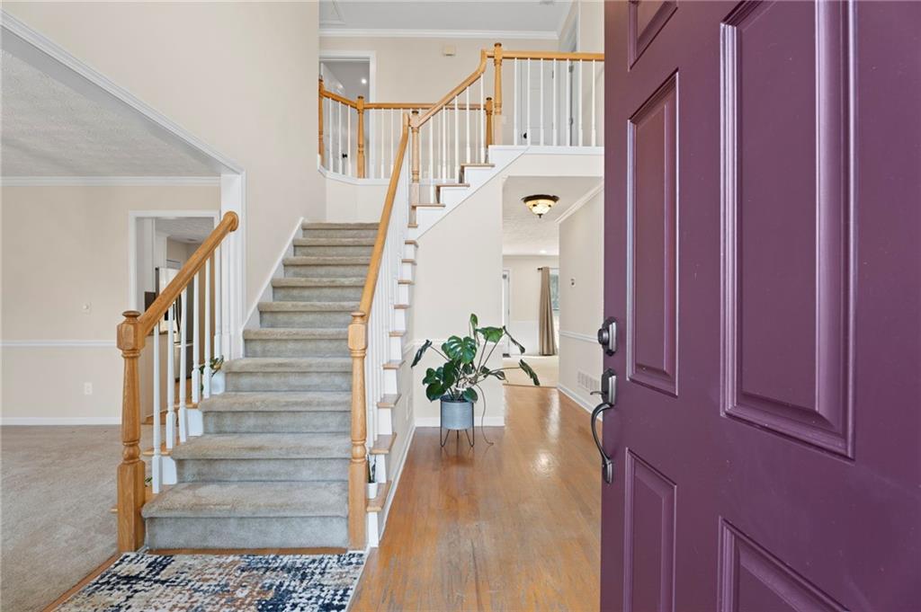 1381 Gateswalk Path Lawrenceville, GA 30045 - Photo 4 of 45 a view of entryway and hall with wooden floor