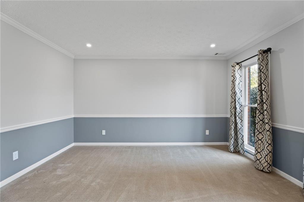 1381 Gateswalk Path Lawrenceville, GA 30045 - Photo 6 of 45 a view of an empty room with a window