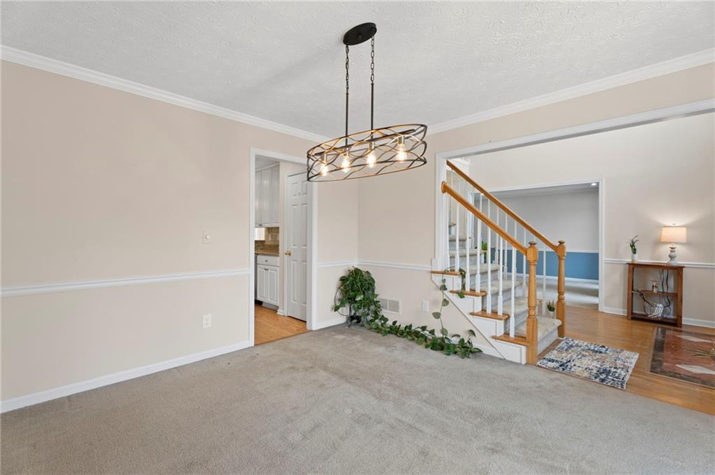 1381 Gateswalk Path Lawrenceville, GA 30045 - Photo 10 of 45 a view of a chandelier and entryway in front of a house