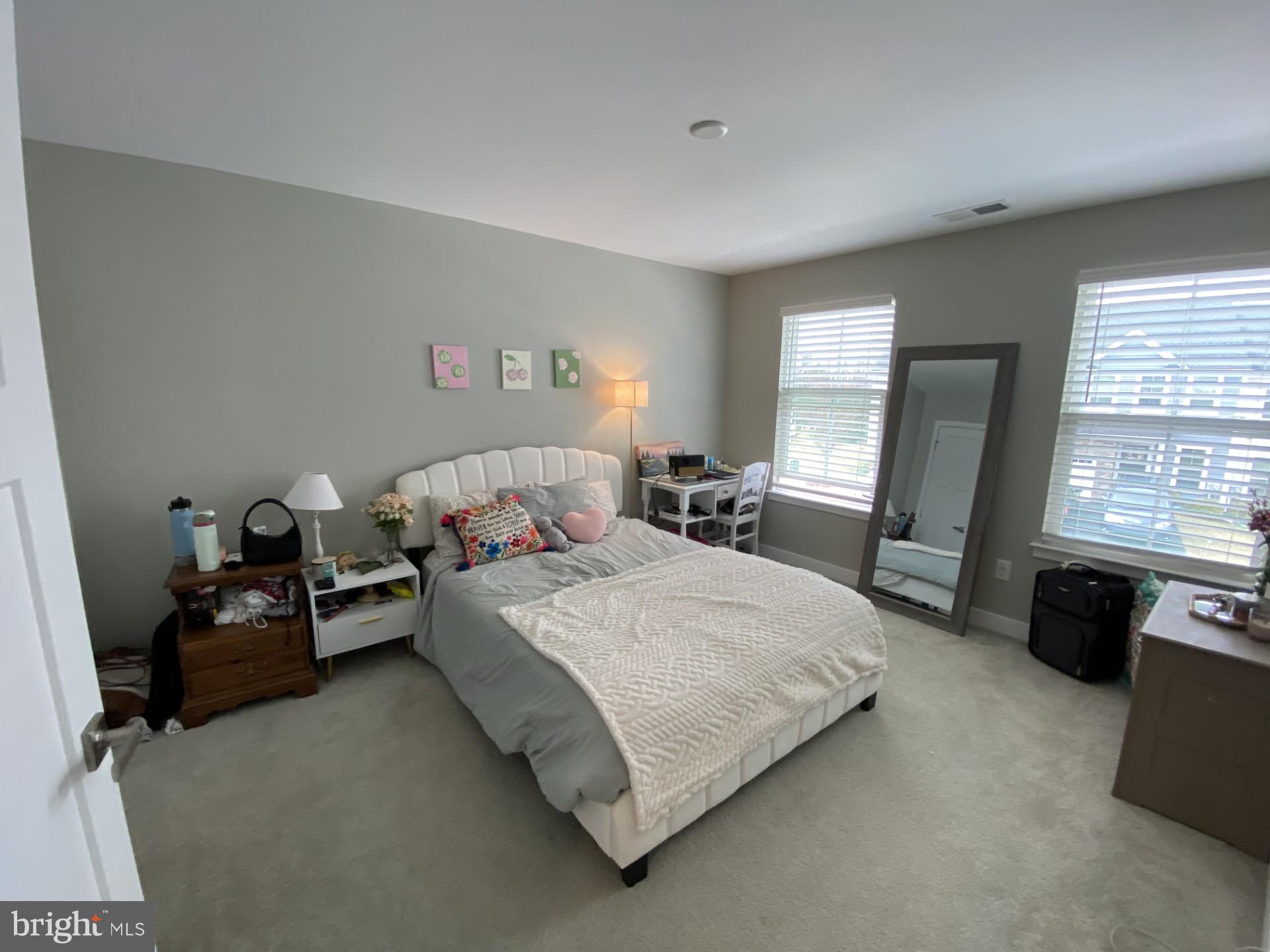 1214 Benjamin Drive Kennett Square, PA 19348 - Photo 16 of 34 a bedroom with a bed and a couch