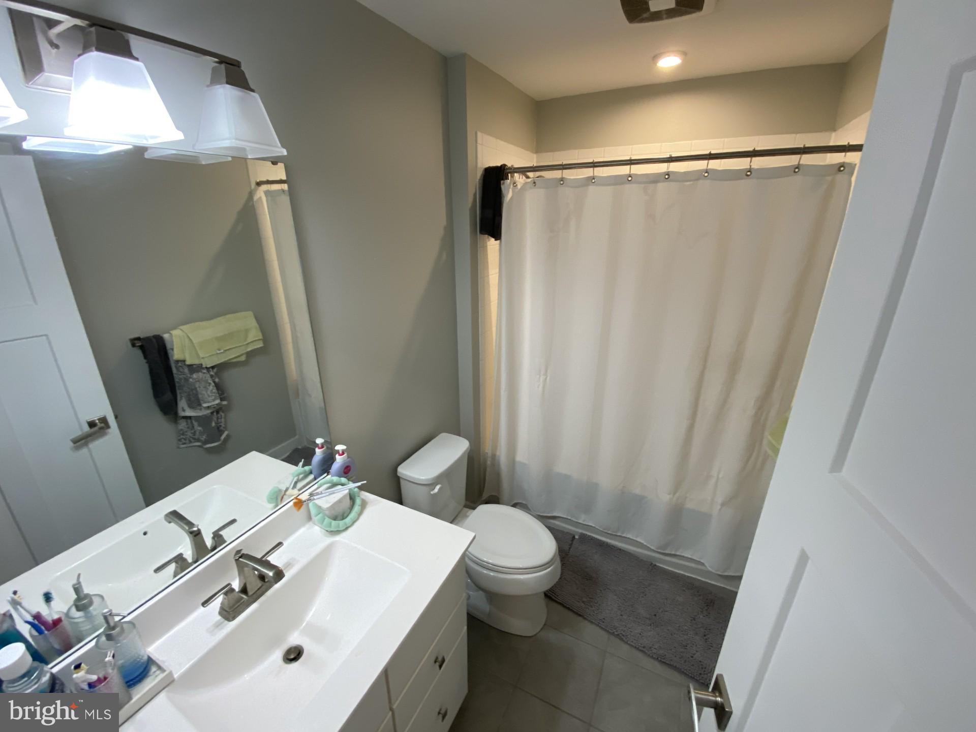 1214 Benjamin Drive Kennett Square, PA 19348 - Photo 18 of 34 a bathroom with a sink and a mirror