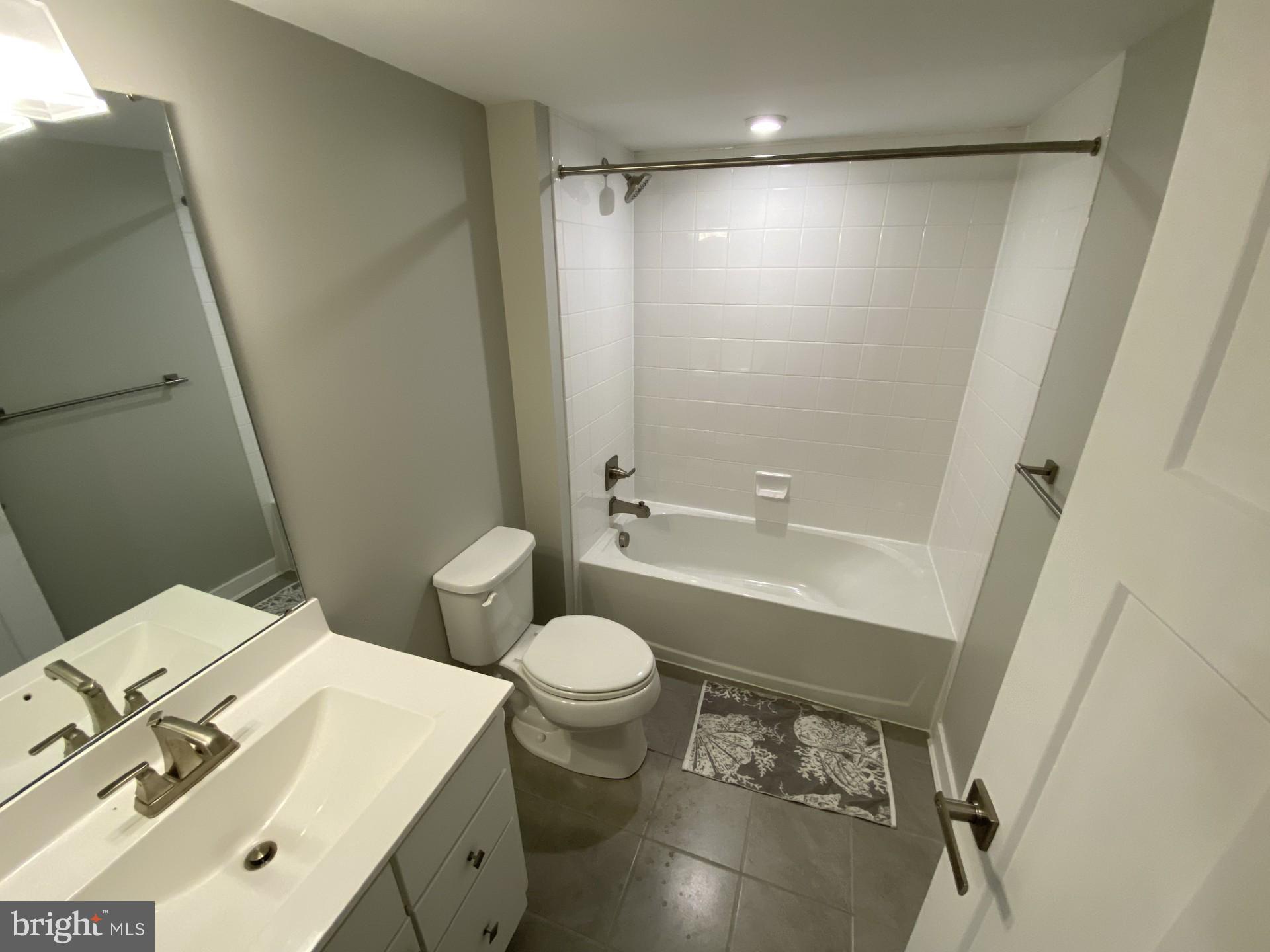 1214 Benjamin Drive Kennett Square, PA 19348 - Photo 21 of 34 a bathroom with a sink a toilet and shower