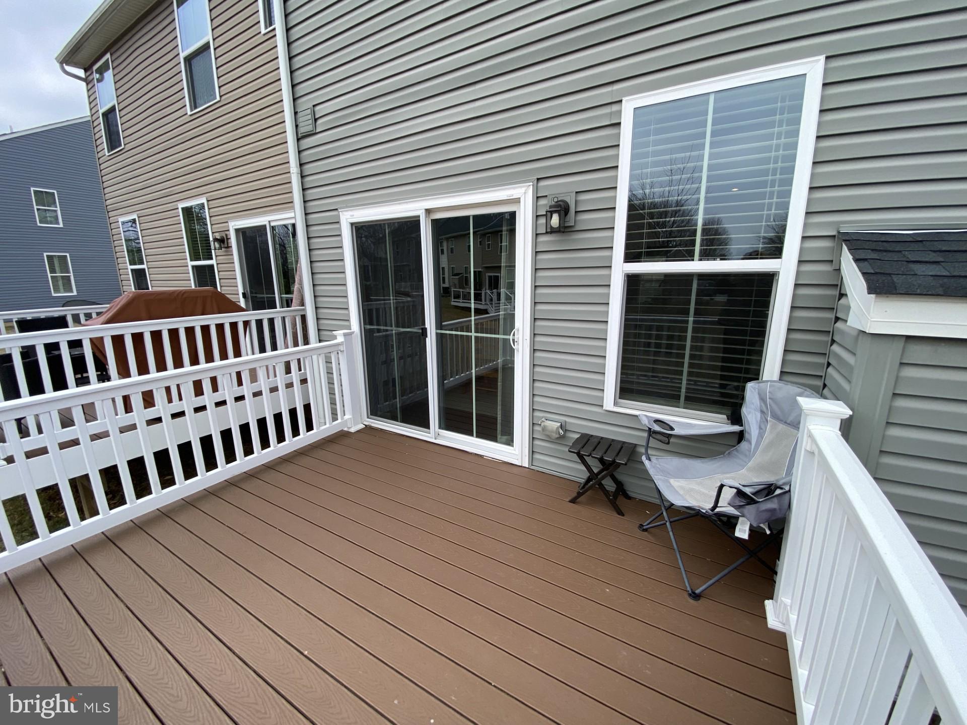 1214 Benjamin Drive Kennett Square, PA 19348 - Photo 23 of 34 a view of a wooden deck with a bench
