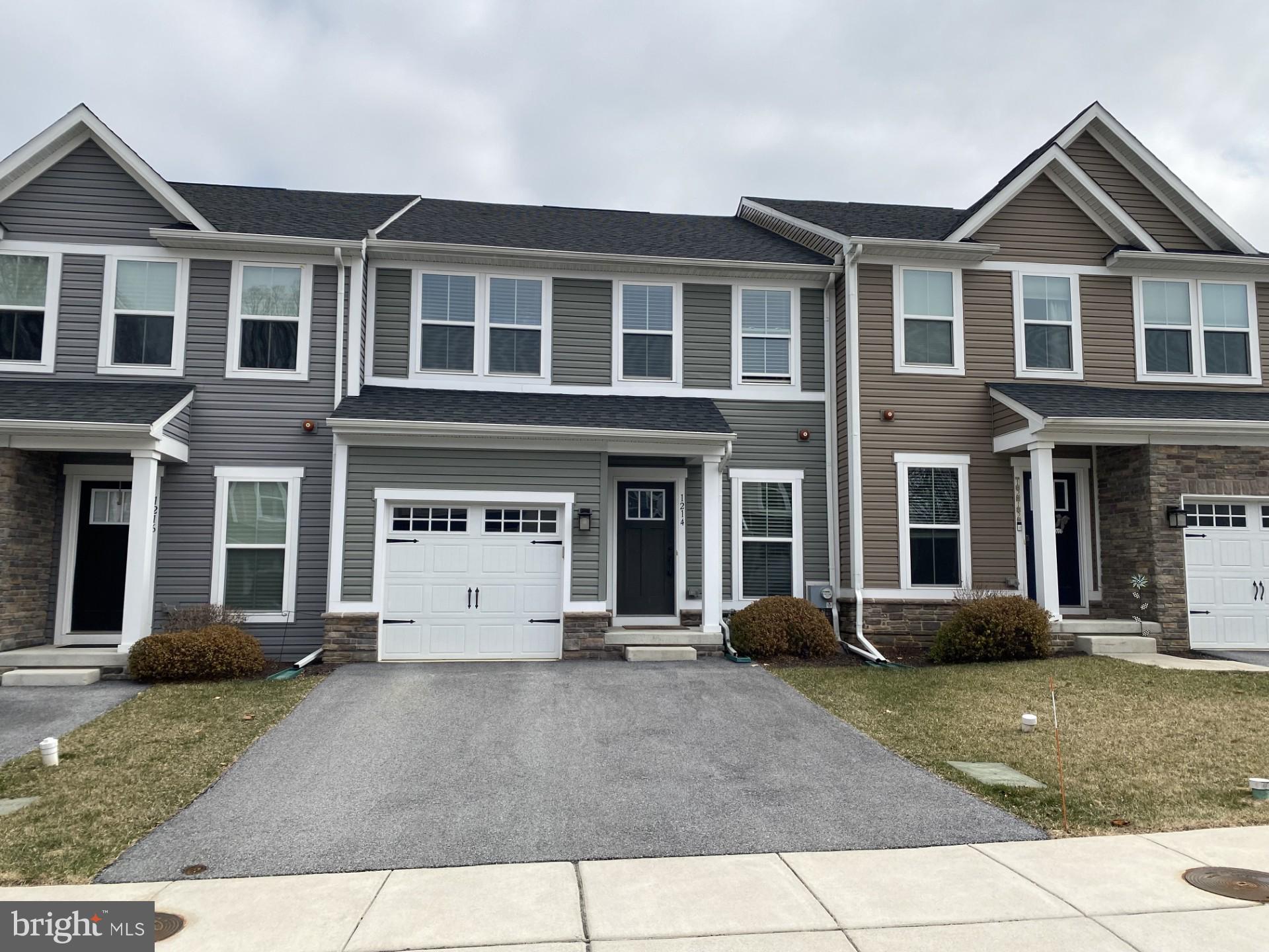 1214 Benjamin Drive Kennett Square, PA 19348 - Photo 3 of 34 a view of a white house with large windows