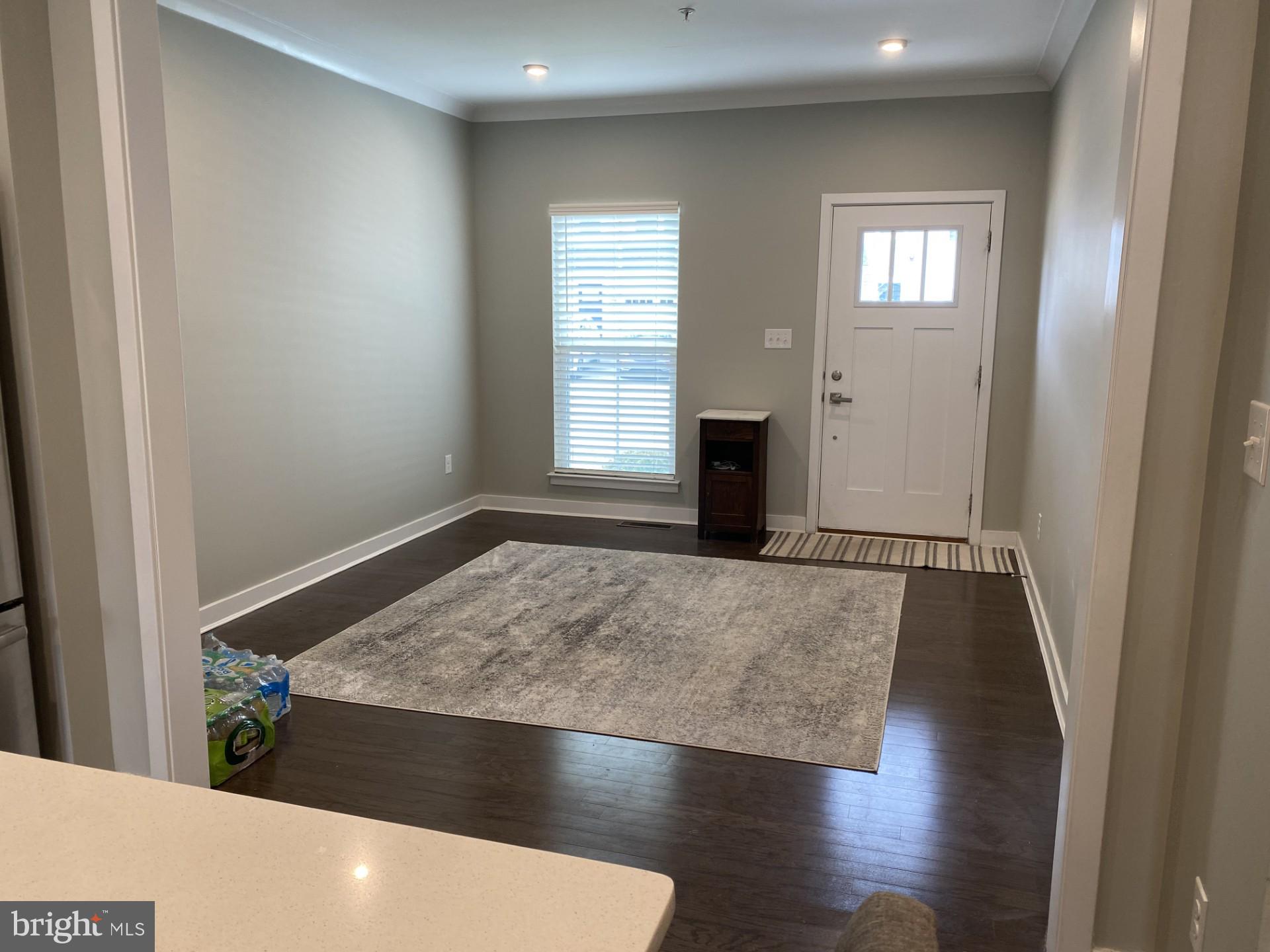 1214 Benjamin Drive Kennett Square, PA 19348 - Photo 4 of 34 an empty room with wooden floor and windows