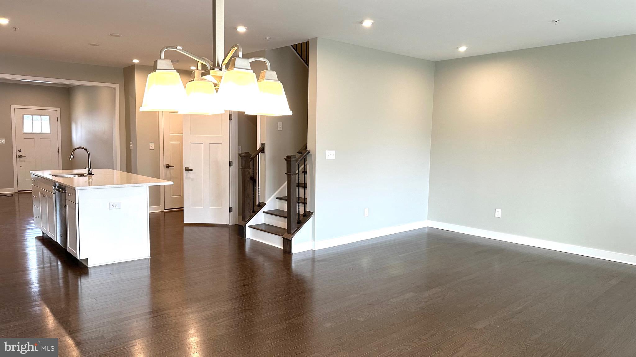 1214 Benjamin Drive Kennett Square, PA 19348 - Photo 6 of 34 an empty room with wooden floor and windows