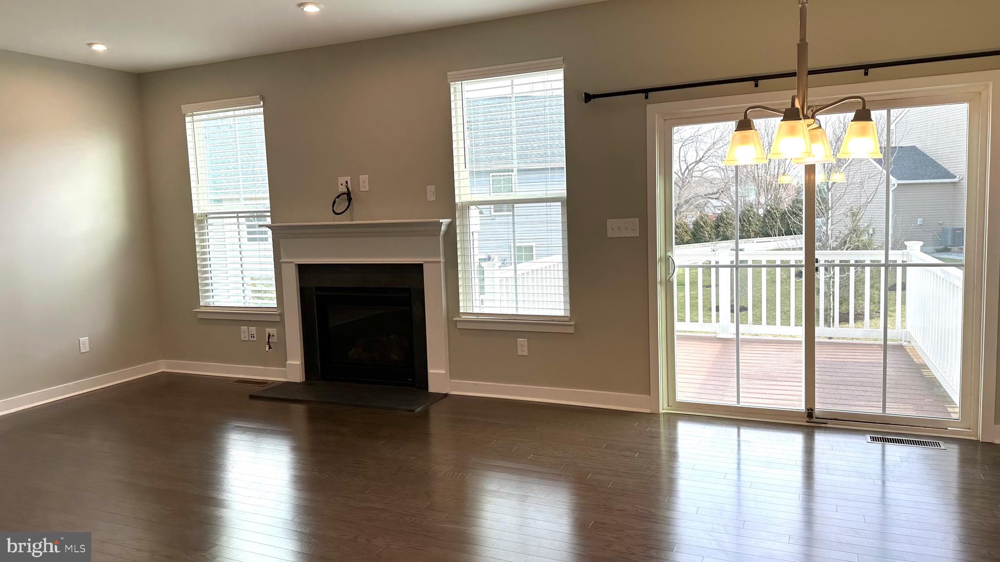 1214 Benjamin Drive Kennett Square, PA 19348 - Photo 7 of 34 a view of empty room with wooden floor and a fireplace