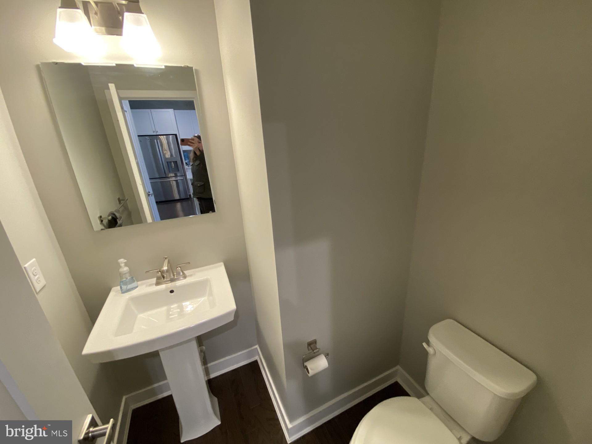 1214 Benjamin Drive Kennett Square, PA 19348 - Photo 10 of 34 a white toilet sitting next to a bathroom sink