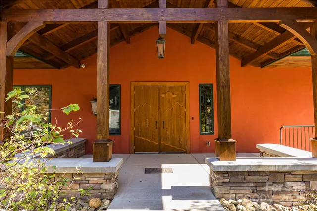 a view of a backyard with plants and a patio