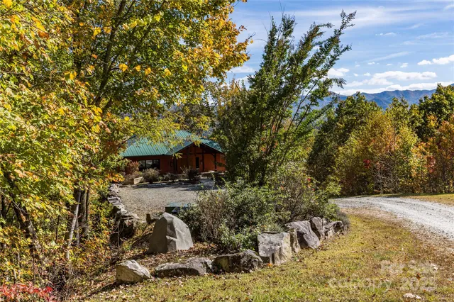 a view of backyard with outdoor seating and green space
