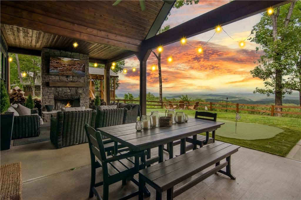 1272 Foxhound Trail Northeast Ranger, GA 30734 - Photo 14 of 69 a view of a patio with a table chairs and a backyard
