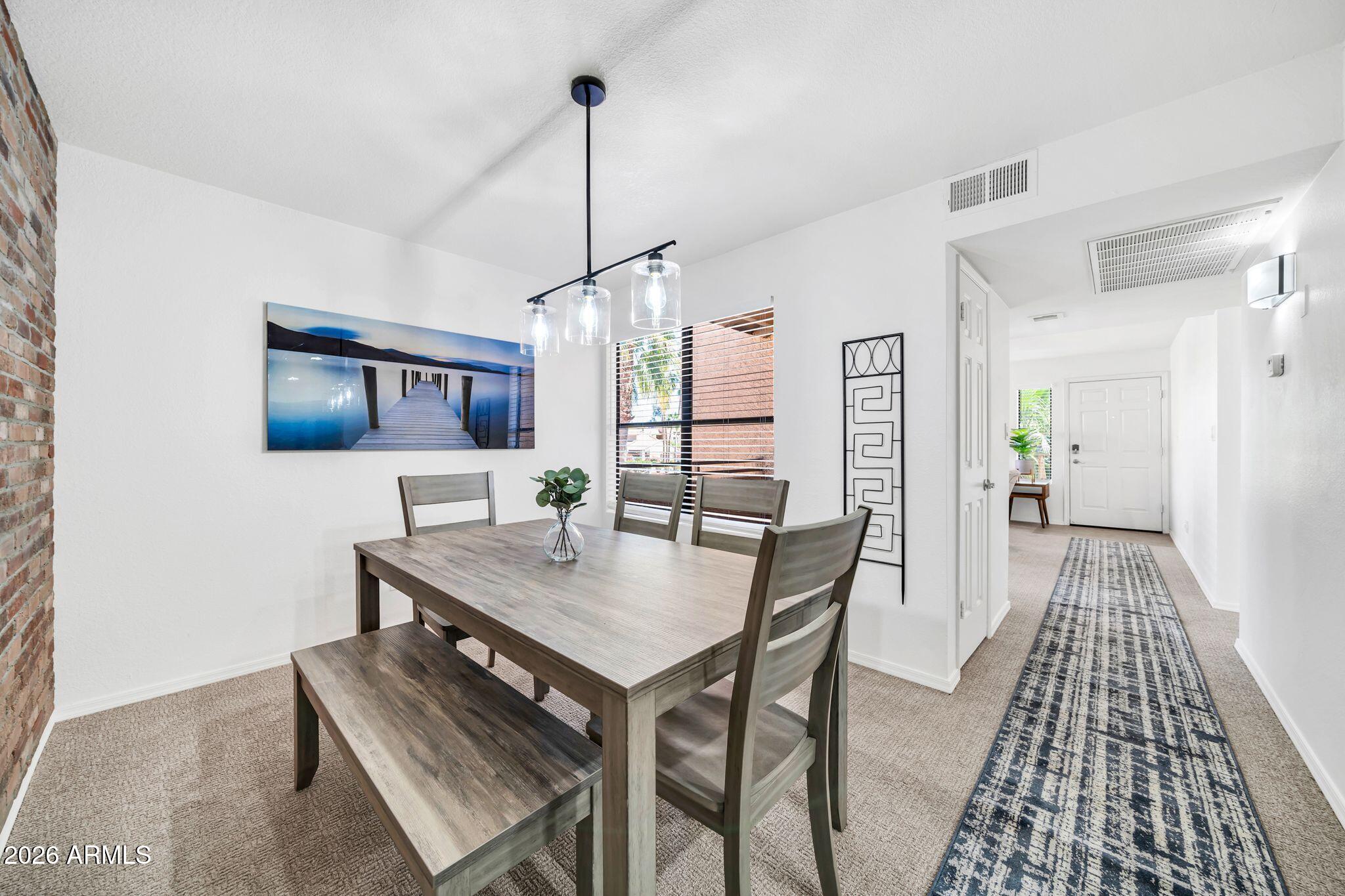 8787 East Mountain View Road, Unit 2038 Scottsdale, AZ 85258 - Photo 11 of 37 a view of a dining room with furniture