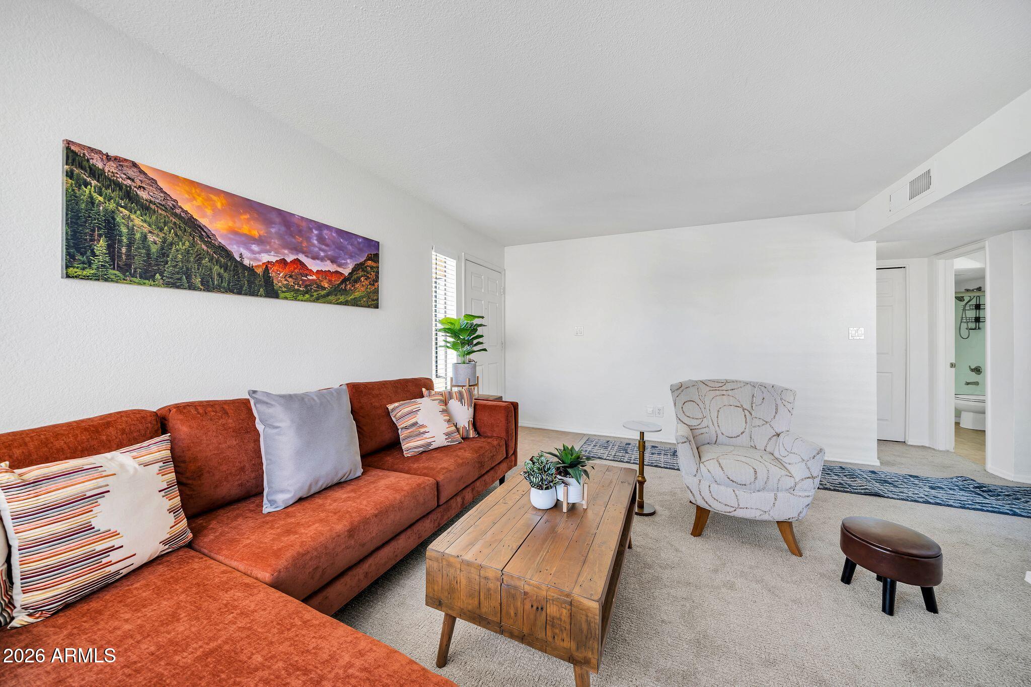 8787 East Mountain View Road, Unit 2038 Scottsdale, AZ 85258 - Photo 12 of 37 a living room with furniture and a couch
