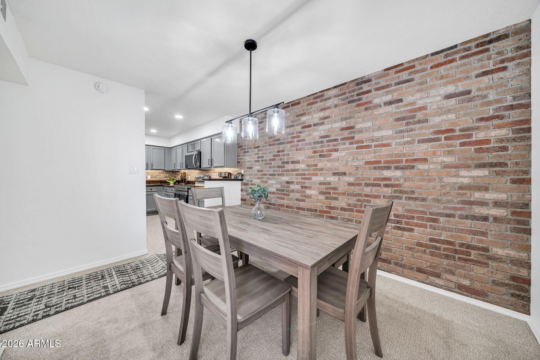 8787 East Mountain View Road, Unit 2038 Scottsdale, AZ 85258 - Photo 13 of 37 a view of a dining room with furniture