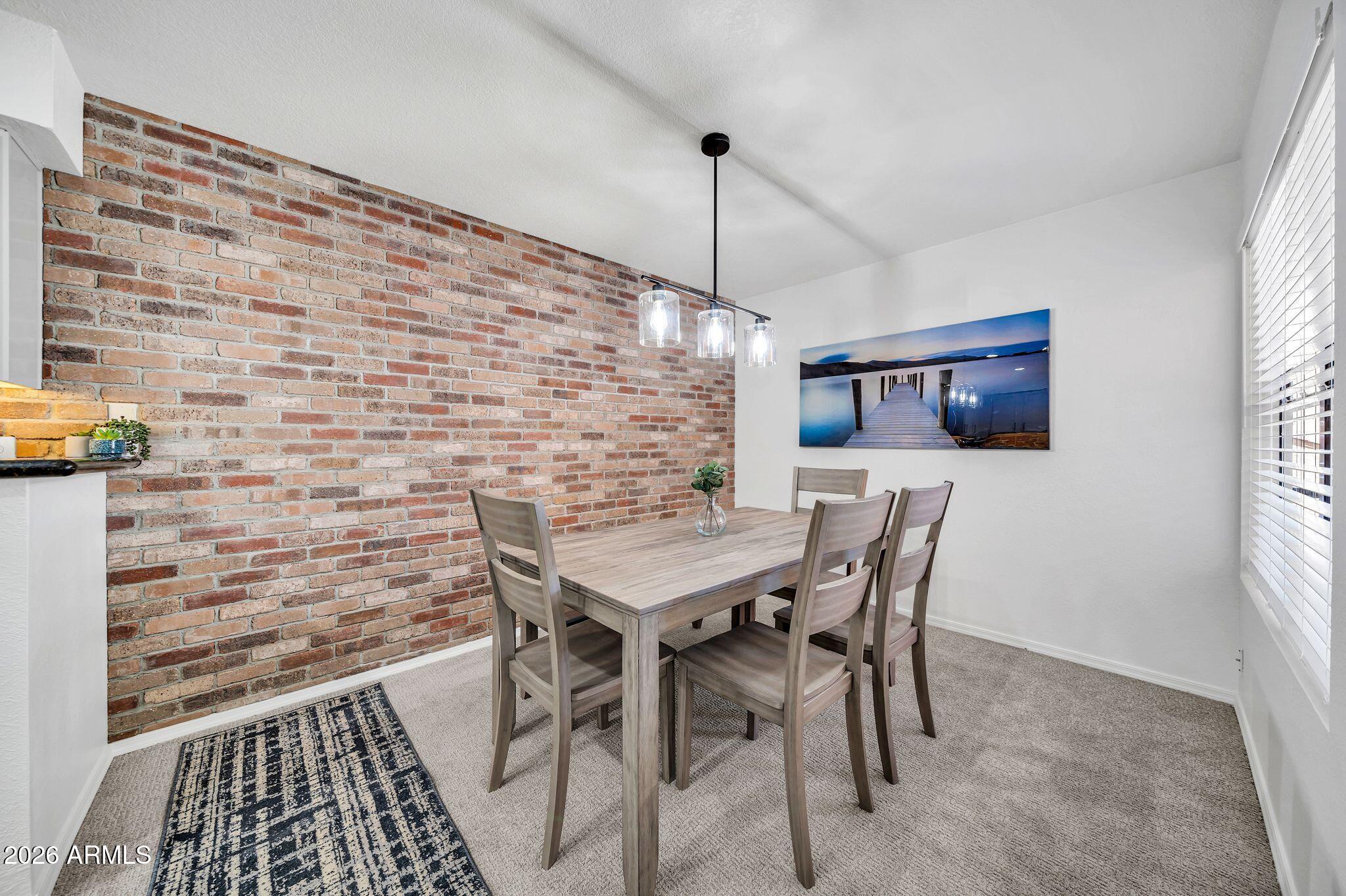 8787 East Mountain View Road, Unit 2038 Scottsdale, AZ 85258 - Photo 2 of 37 a view of a dining room with furniture and window