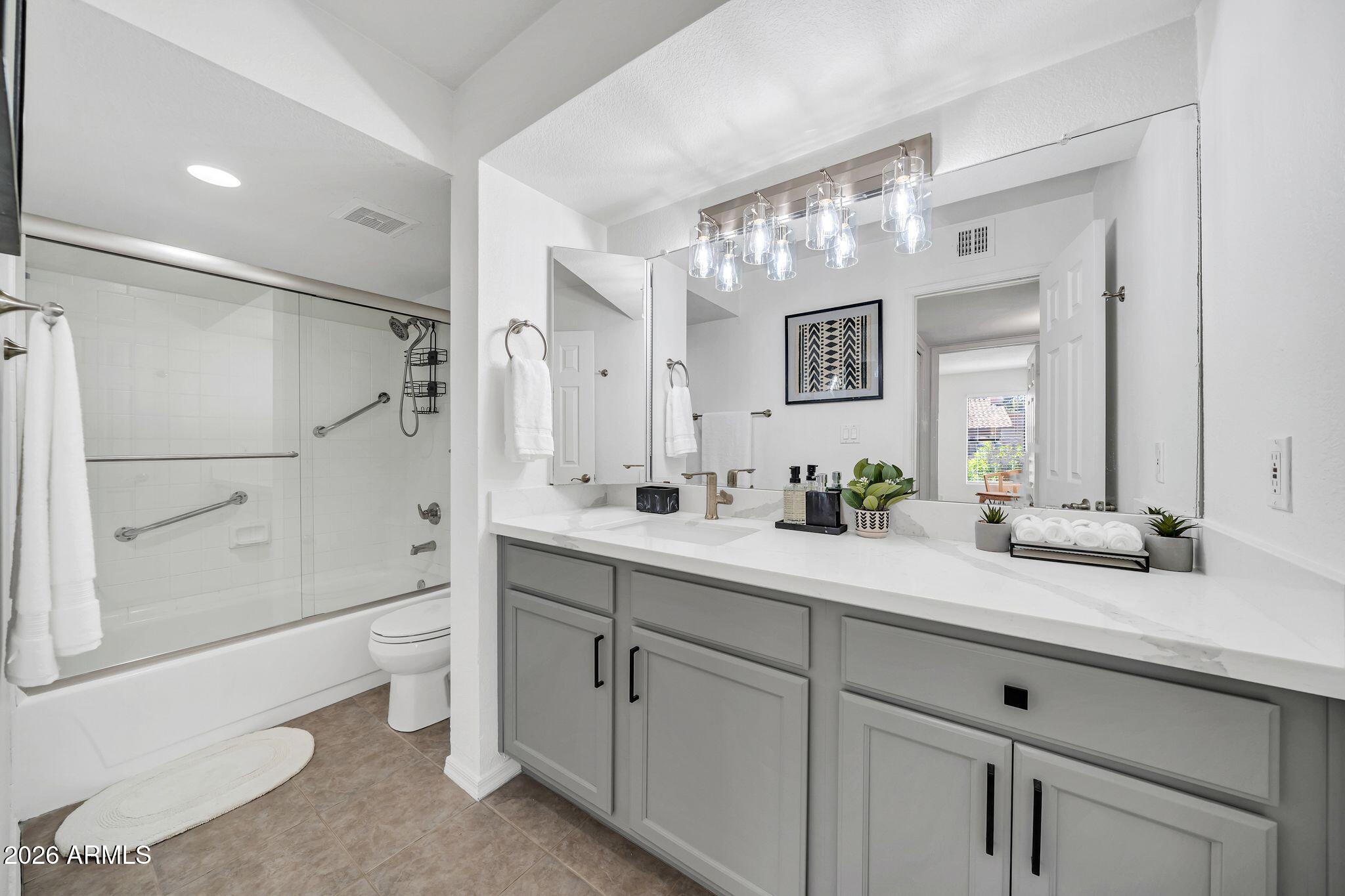 8787 East Mountain View Road, Unit 2038 Scottsdale, AZ 85258 - Photo 22 of 37 a spacious bathroom with double sink and a mirror