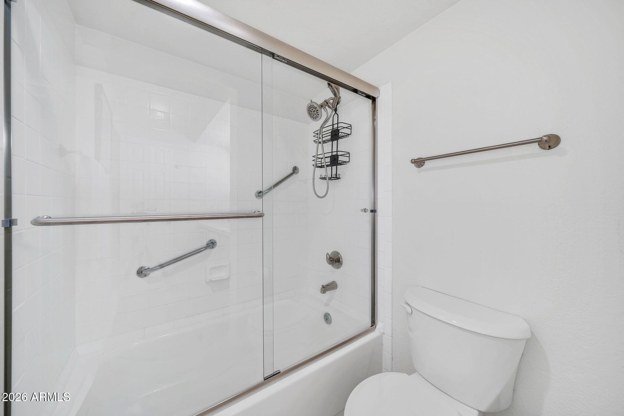 8787 East Mountain View Road, Unit 2038 Scottsdale, AZ 85258 - Photo 27 of 37 a bathroom with a shower and toilet