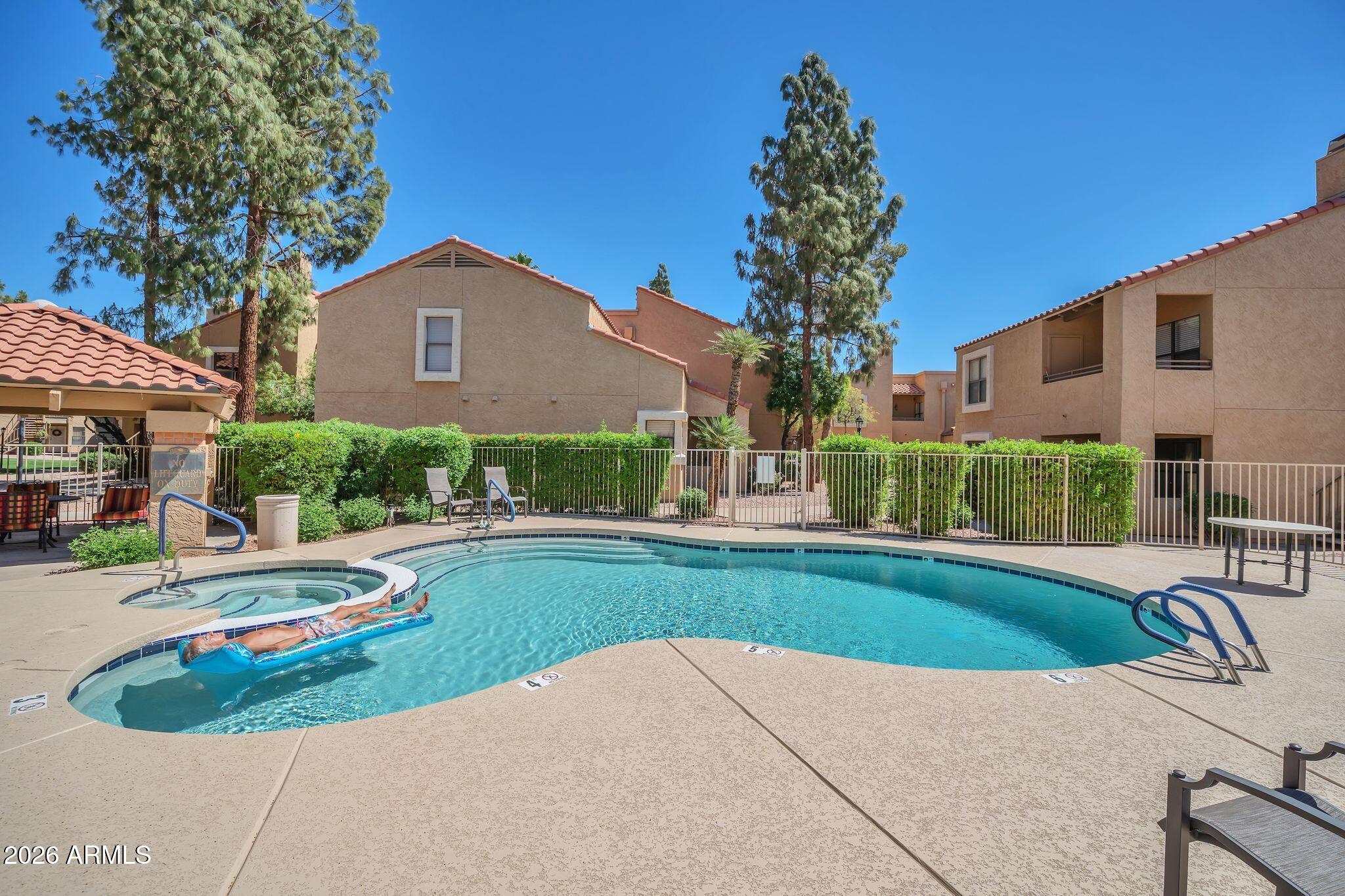 8787 East Mountain View Road, Unit 2038 Scottsdale, AZ 85258 - Photo 29 of 37 a view of a house with a yard