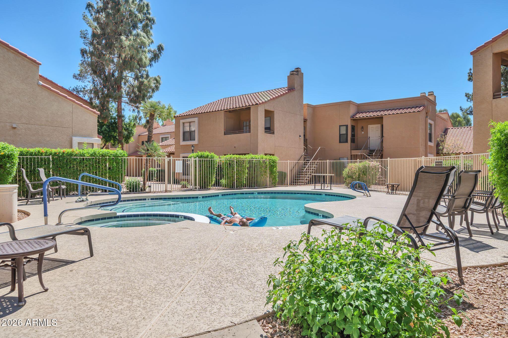 8787 East Mountain View Road, Unit 2038 Scottsdale, AZ 85258 - Photo 30 of 37 a view of a house with backyard and sitting area