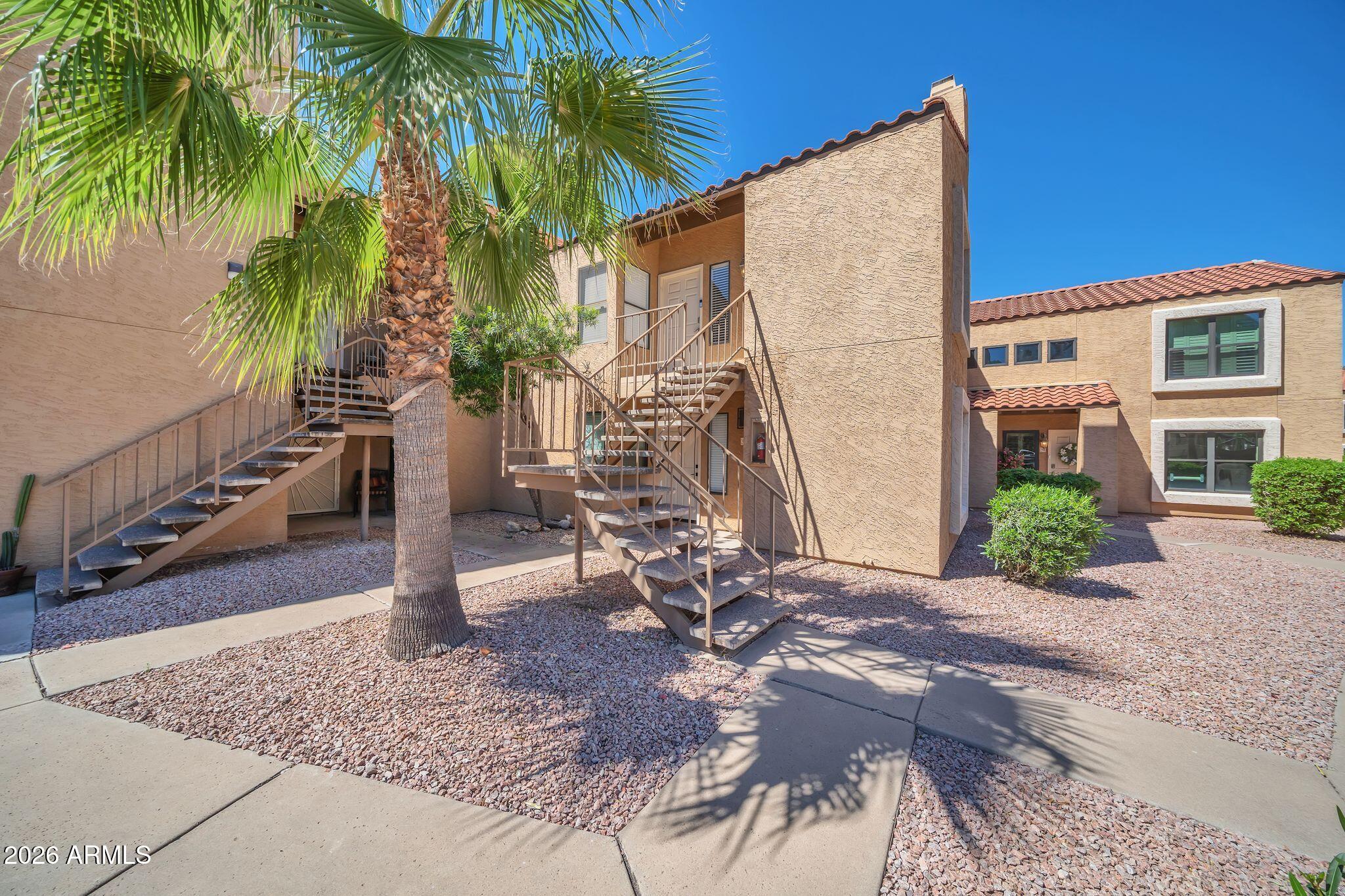 8787 East Mountain View Road, Unit 2038 Scottsdale, AZ 85258 - Photo 7 of 37 a view of a house with a patio